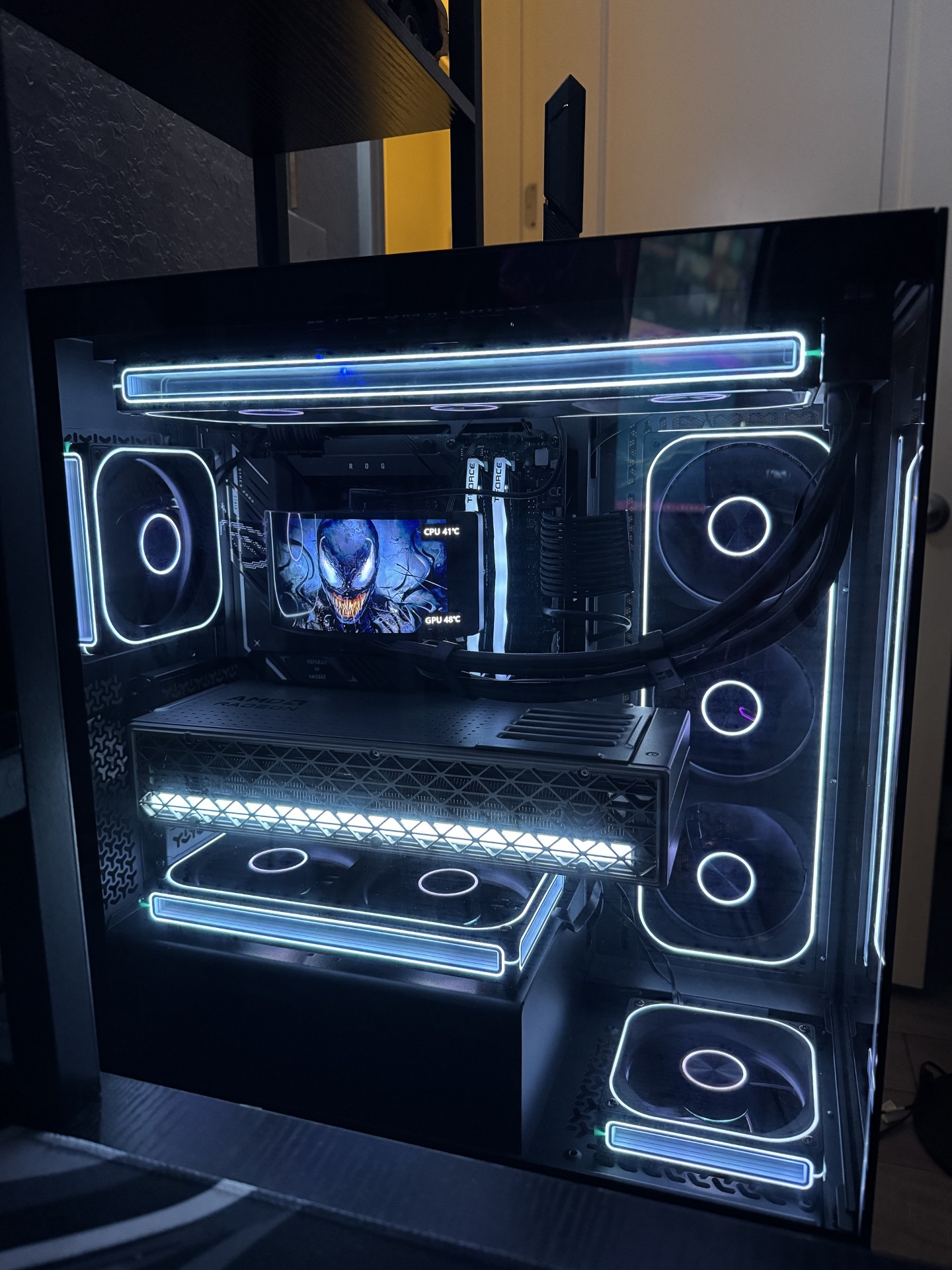 Main PC build with ROG branding and white ARGB lighting
